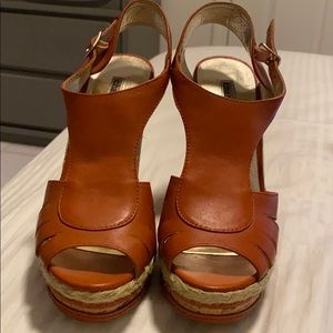 Charles David orange size wedges.